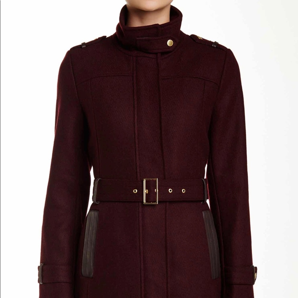 Cole Haan plum wool blend pea coat. Has leather and gold details. Belted waist.
